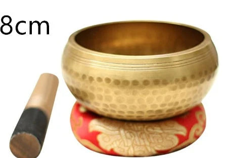 A handcrafted Tibetan singing bowl made of copper, used for meditation and relaxation.