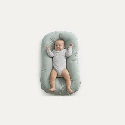 Portable baby nest crib with cotton cover for newborns, dimensions 75cm by 45cm