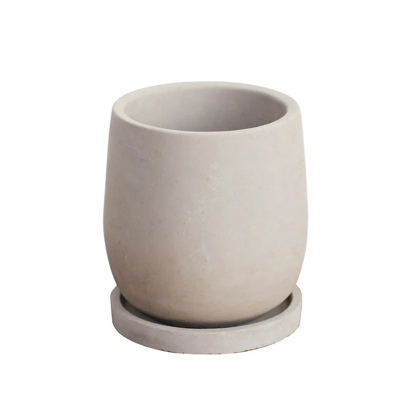 Elegant round cement flower pot with tray for healthy plants