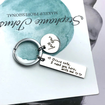 Unisex stainless steel safe driving keychain with elegant lettering