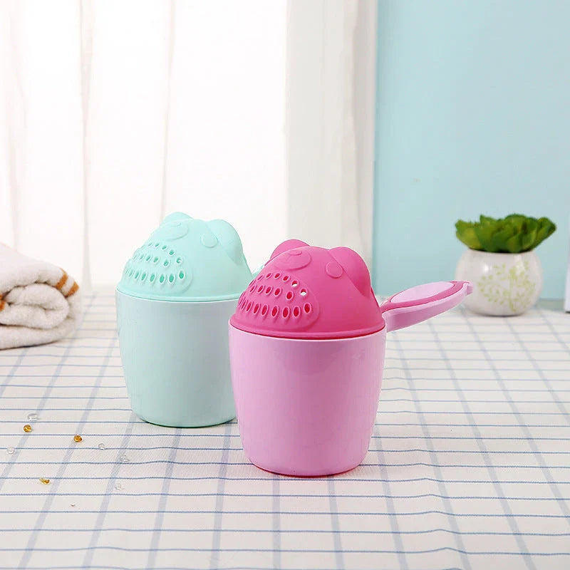 Shampoo rinse cup for baby bath time with comfortable handle and bright, colourful design