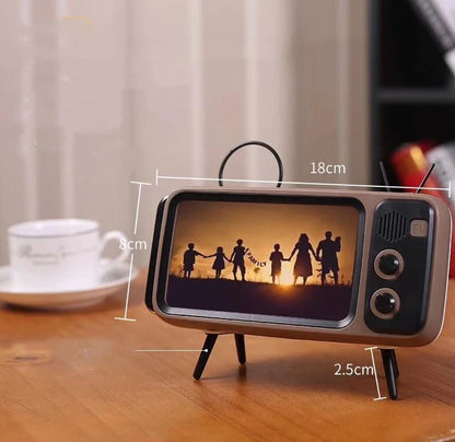 Vintage-inspired portable Bluetooth speaker with retro TV-style design and sleek, compact body