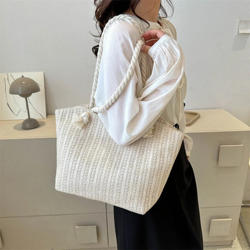 Stylish women's straw shoulder tote bag with large capacity, perfect for summer and everyday use.