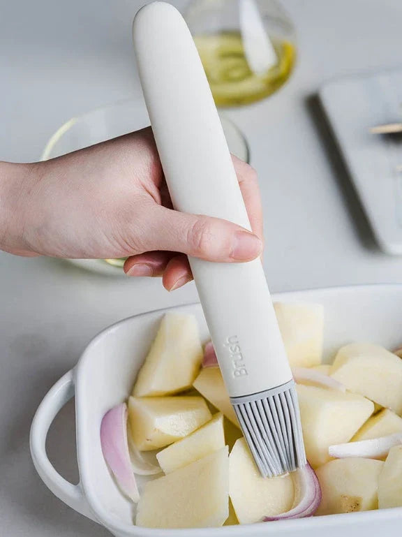 Premium silicone basting brush with sturdy, non-slip handle and flexible head for even distribution of sauces, oils, and glazes on meats, baked goods, and more.