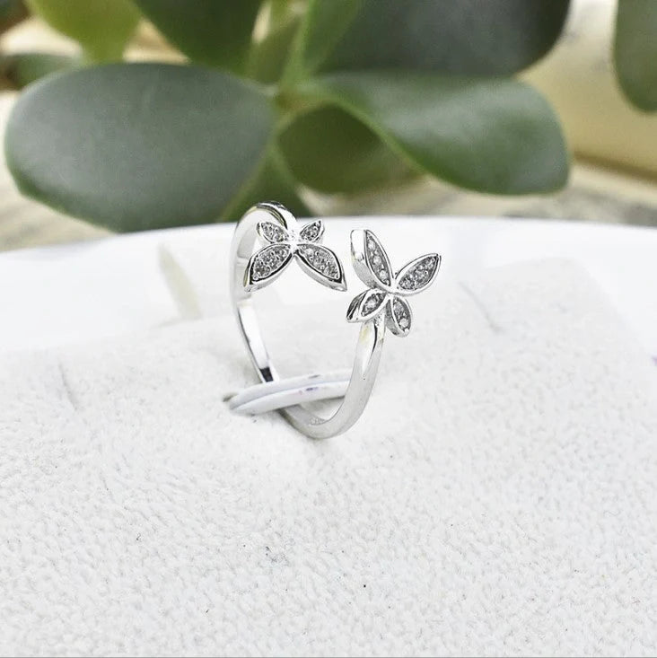 Sterling Silver Adjustable Butterfly Ring with gem accents on a white background