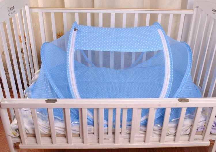 Foldable baby mosquito net bed with soft mattress and pillows, providing a safe and comfortable sleeping environment for infants and toddlers.
