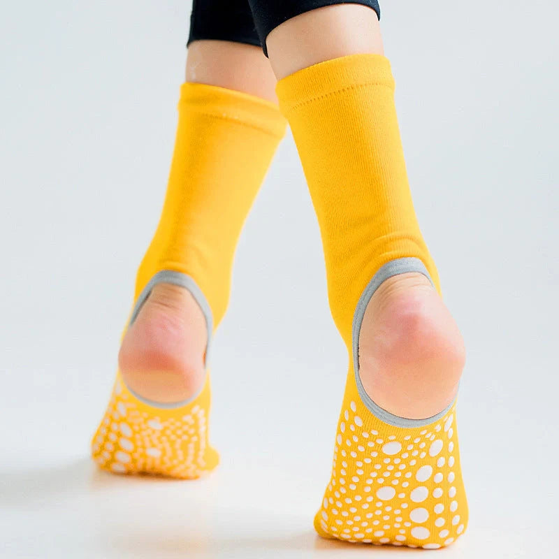 Premium non-slip yoga socks for women featuring split-toe design, jacquard knitting, and breathable combed cotton construction