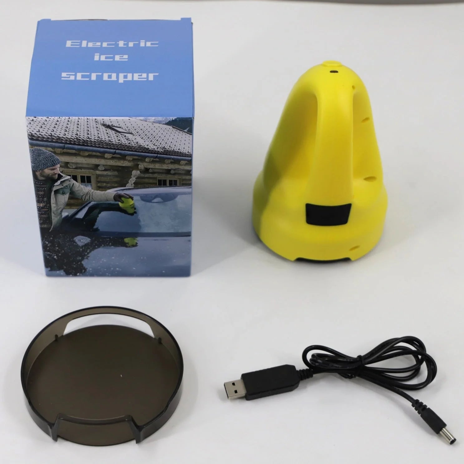 Electric snow scraper with yellow body and rotating disc for ice removal