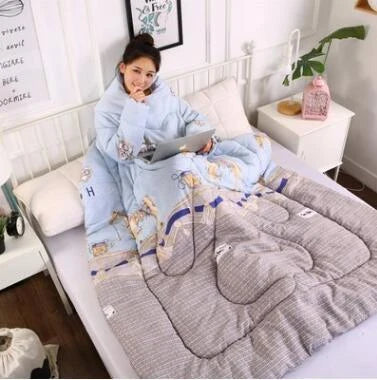 Cozy quilted lounger with sleeves in various colors and sizes, perfect for year-round indoor comfort and relaxation.