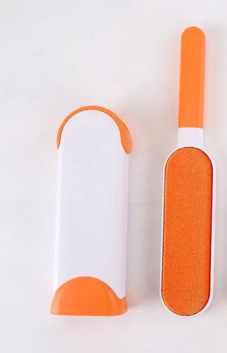 A reusable pet hair remover comb with a self-cleaning base, perfect for removing fur and lint from sofas, chairs, and other upholstery.