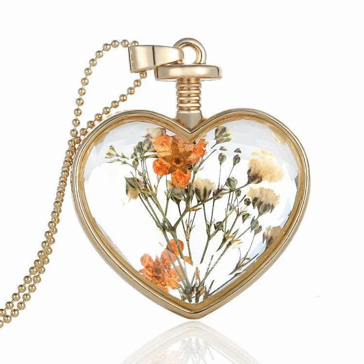 Elegant glass-encased dried flower pendant necklace with bead chain, showcasing a variety of preserved floral arrangements.