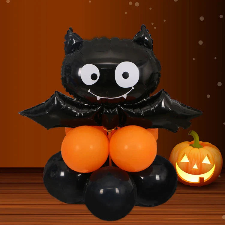Spooky Halloween balloon decorations featuring pumpkins and bats in various styles