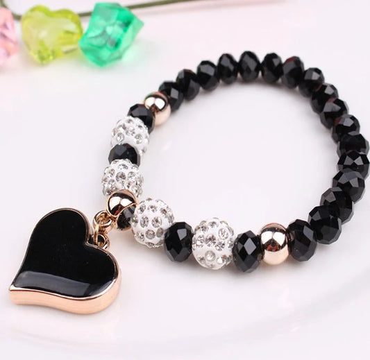Elegant crystal heart-shaped bracelets in various vibrant colours, perfect for adding a touch of sophistication to any outfit