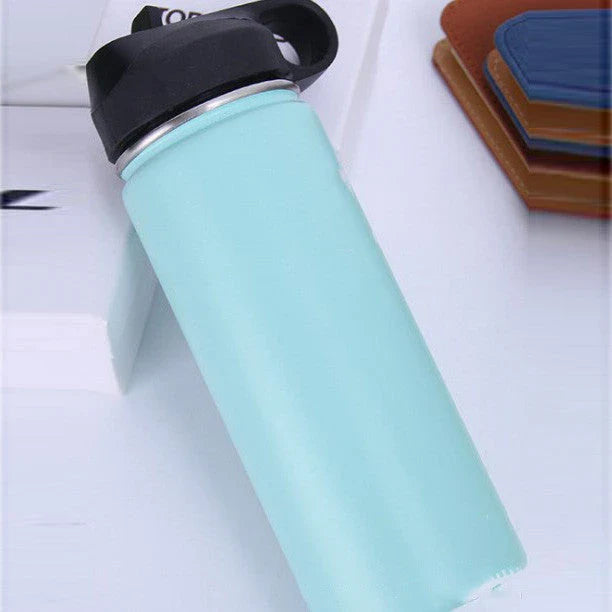Premium stainless steel insulated tumbler with push-button lid and sleek design for outdoor adventures and active lifestyles.