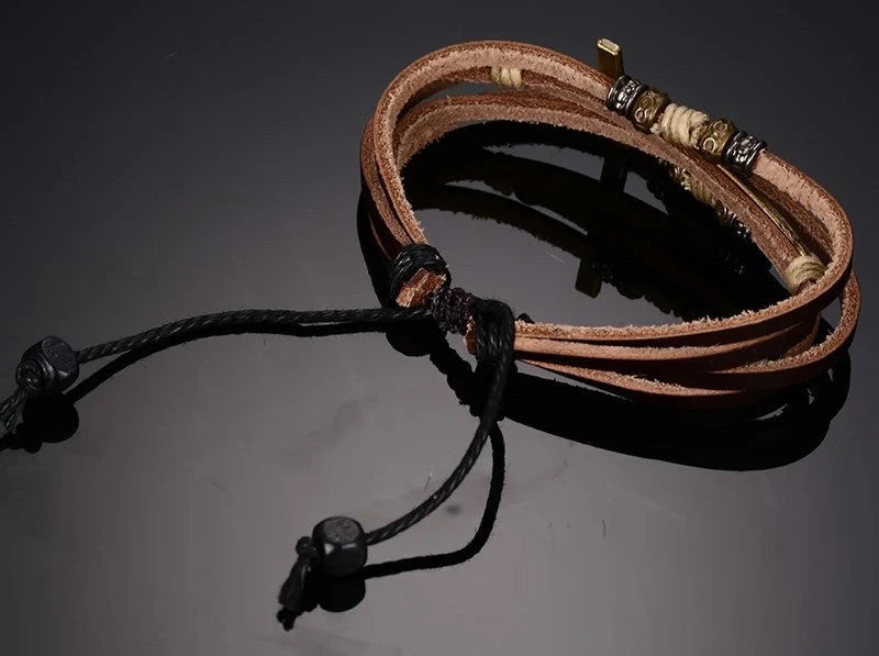 Rugged leather cross bracelet with durable construction and adjustable fit, a versatile accessory for the modern British gentleman