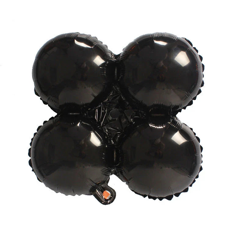 Spooky Halloween balloon decorations featuring pumpkins and bats in various styles