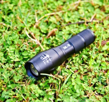 High-powered outdoor LED flashlight with adjustable beam and durable aluminum alloy construction