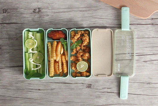A stylish microwave-safe lunch box with a removable soup mug in various colours, including pink, green, and apricot