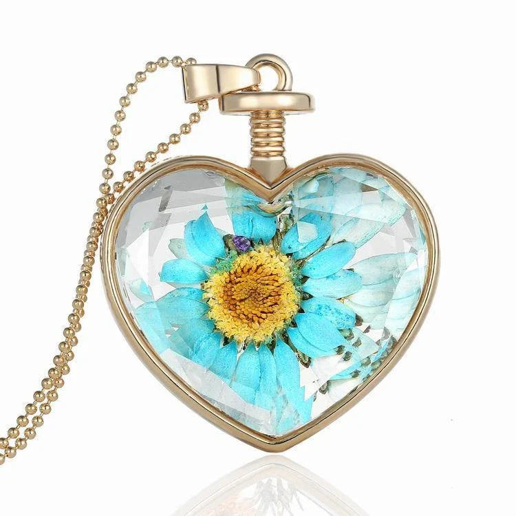 Elegant glass-encased dried flower pendant necklace with bead chain, showcasing a variety of preserved floral arrangements.