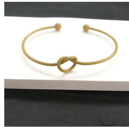 Elegant knotted O-type metal openwork bracelet in various colours