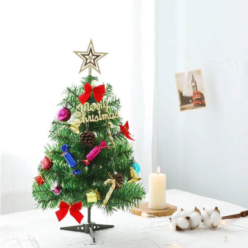Mini Christmas tree with snowflake LED lights and decorative bows, bells, and pine cones