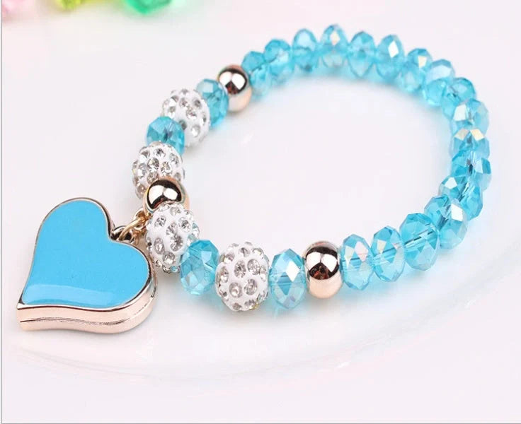 Elegant crystal heart-shaped bracelets in various vibrant colours, perfect for adding a touch of sophistication to any outfit