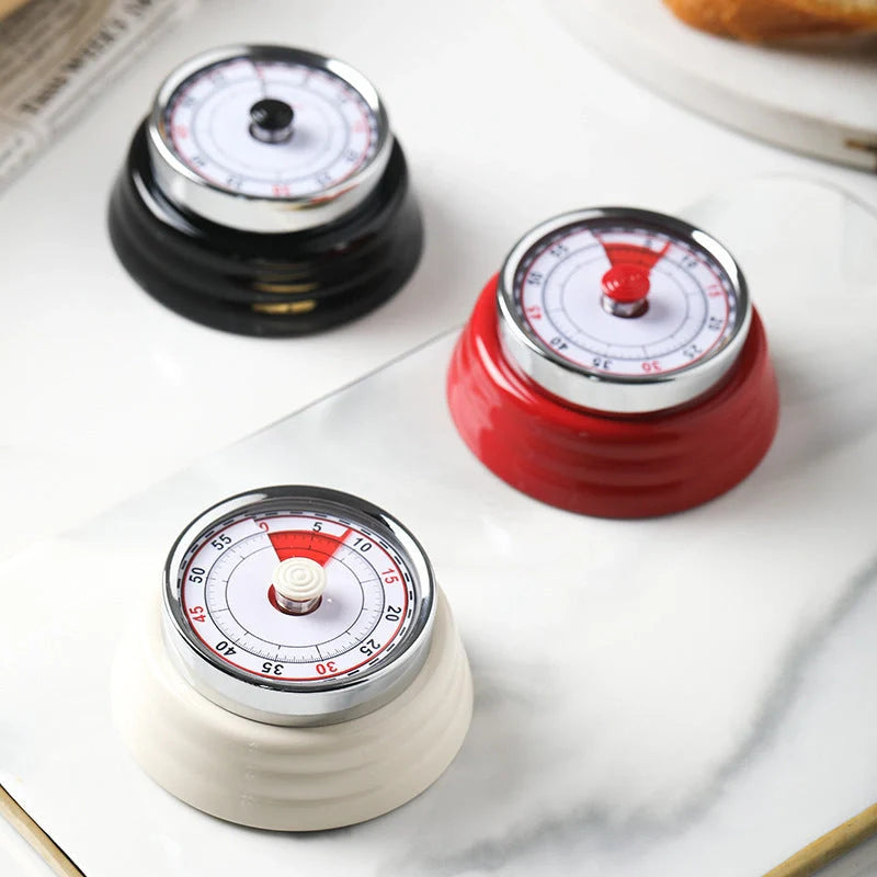 Stainless steel mechanical kitchen timer with magnetic back in black, red, or white
