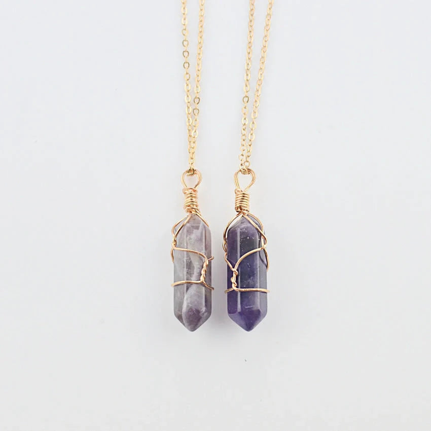 Elegant hexagonal quartz crystal necklace pendant on gold chain
