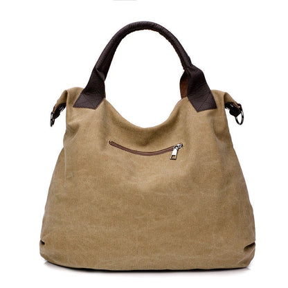 Stylish and versatile canvas shoulder bag with premium brass hardware and thoughtful interior organisation