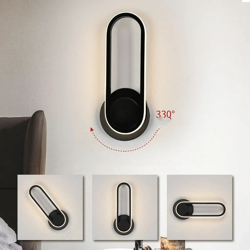 A modern bedside reading wall light with a sleek metal frame and adjustable acrylic shade, providing customisable ambient lighting for a British bedroom.