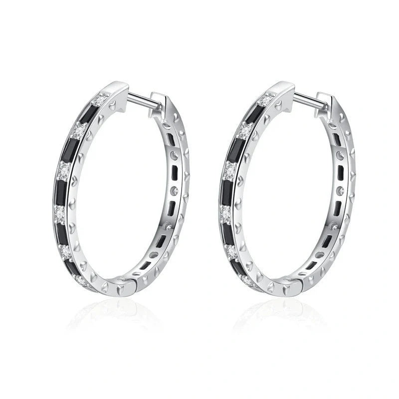A pair of elegant black zircon earrings with a round, geometric design made of premium copper