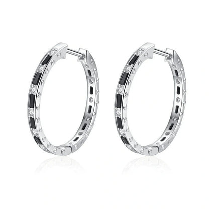 A pair of elegant black zircon earrings with a round, geometric design made of premium copper