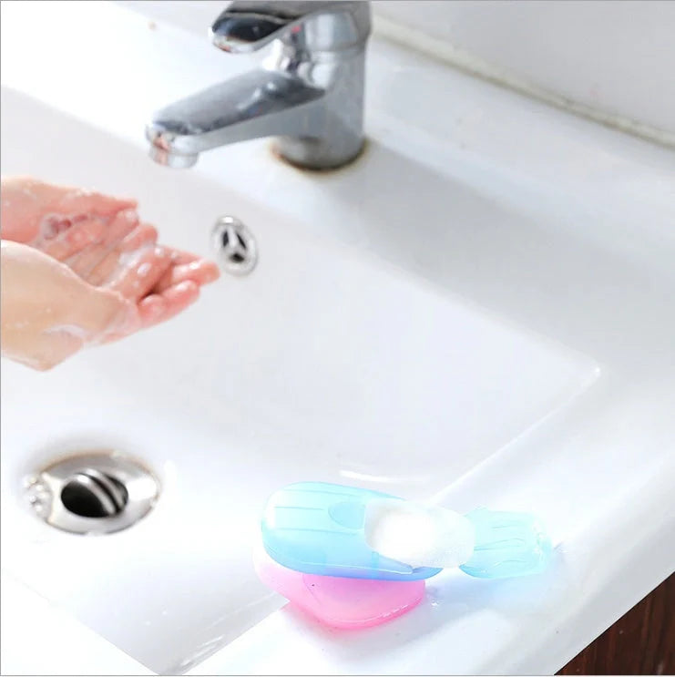 Compact disposable hand soap sheets in various colors, perfect for travel hygiene.