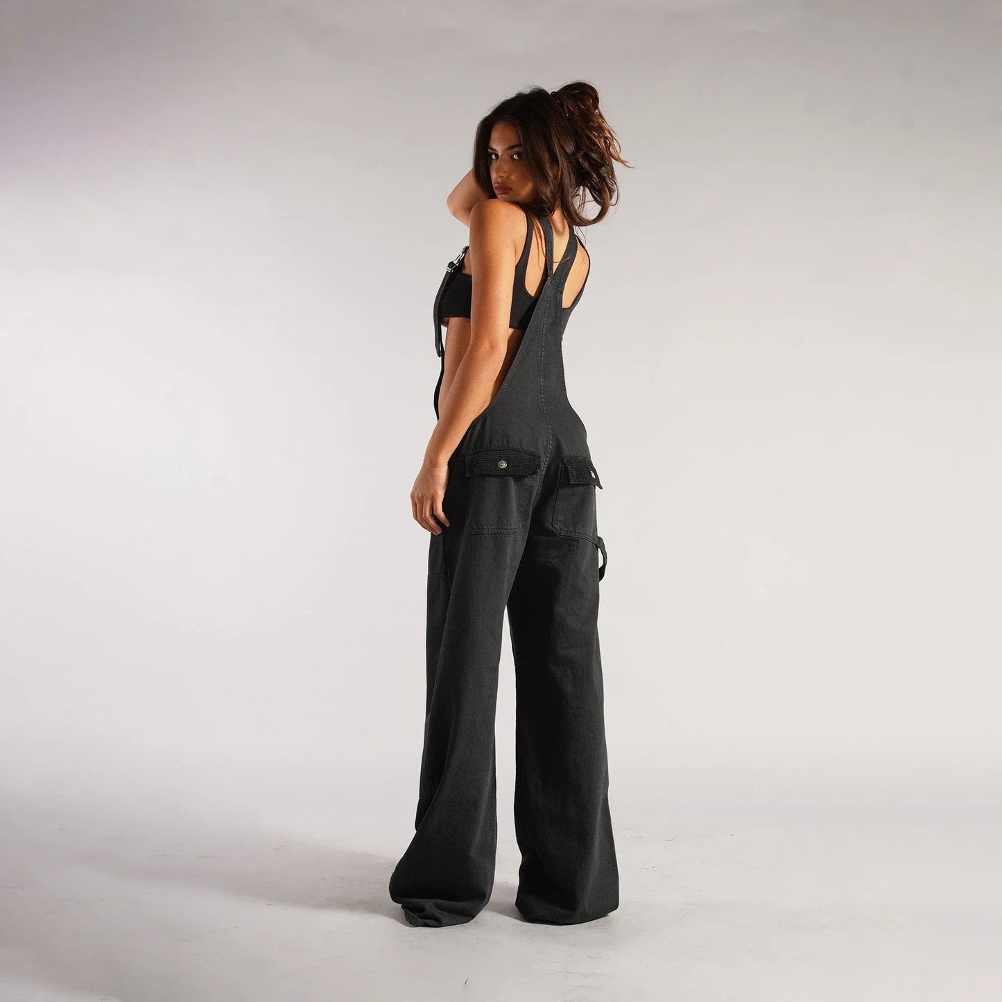 Stylish denim overalls with adjustable suspender straps, front and back pockets, and a comfortable micro-elastic fit, available in a variety of chic colors.