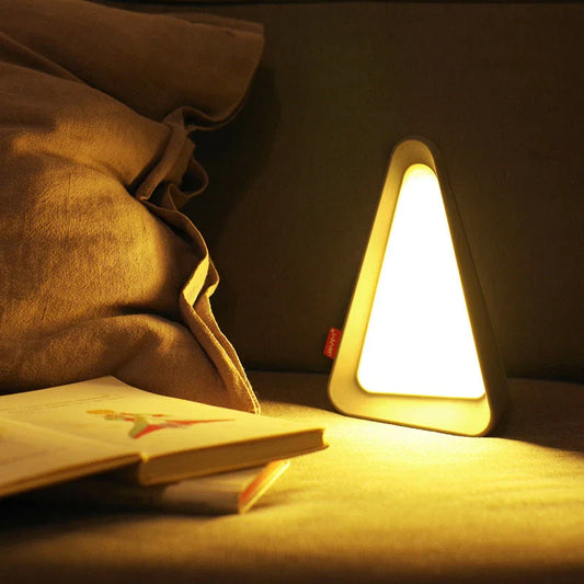 Adjustable flip-up LED night light with USB charging, dimmable brightness, and compact, creative design perfect for desks or bedside tables