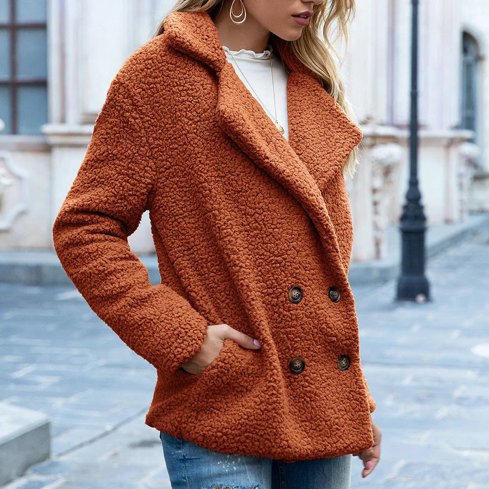 Cozy and stylish winter jacket for women, featuring a fluffy design, button closure, and a range of color options