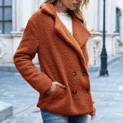 Cozy and stylish winter jacket for women, featuring a fluffy design, button closure, and a range of color options