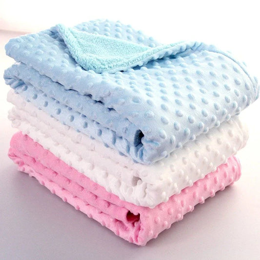 Premium plush baby blanket in various colours, perfect for swaddling, strolling, and creating a cosy nursery environment