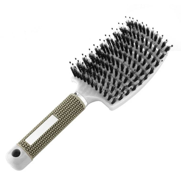 A premium hair brush with a sleek design, featuring soft bristles and a rounded massage function for healthy, detangled hair