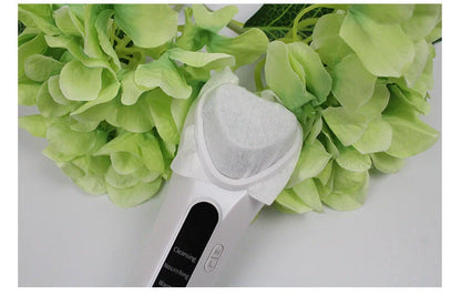 Electric Ultrasonic Facial Beauty Device in white, compact and efficient for daily skincare