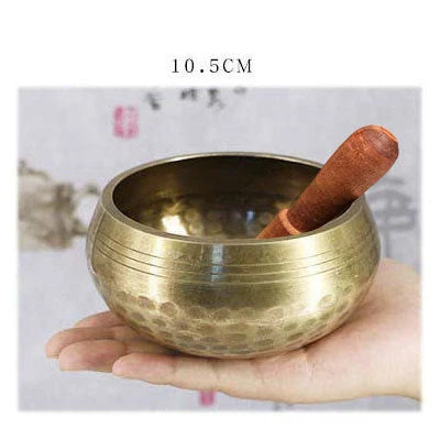 A handcrafted Tibetan singing bowl made of copper, used for meditation and relaxation.