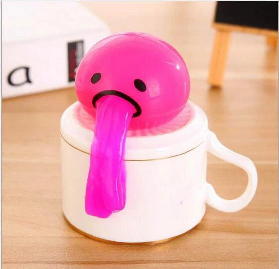 Gudetama Vomiting Egg Toy in green, orange, pink, and yellow