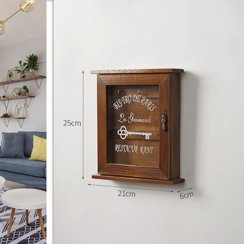 Vintage-style wooden key cabinet with six hanging hooks, offering a compact and stylish storage solution for your keys and small items.