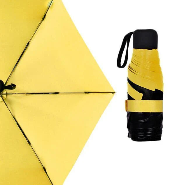 Compact folding umbrella in multiple colours, offering sun protection and windproof design for all-weather use in the UK