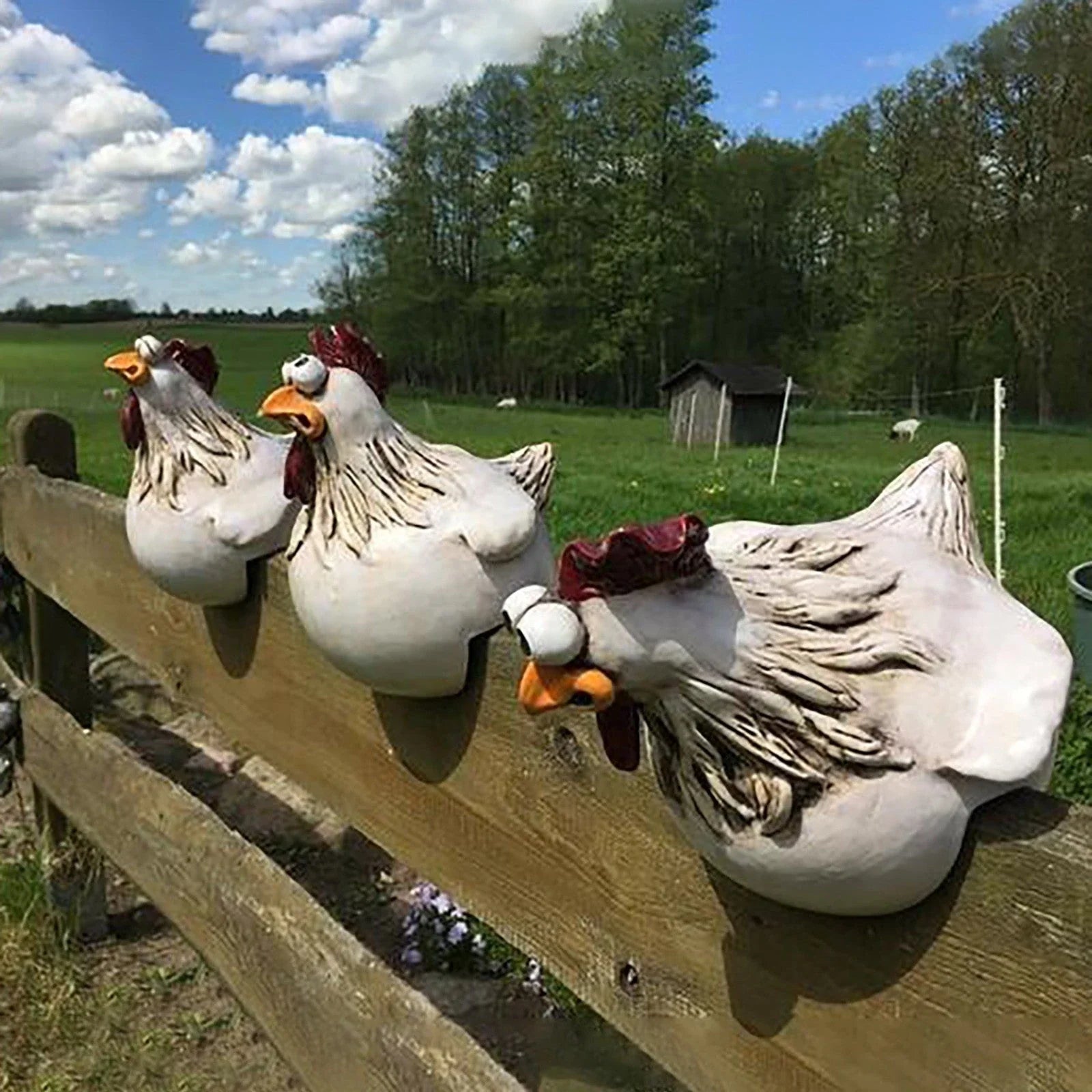 Charming resin chicken garden ornament with vibrant colours and playful design, perfect for adding a whimsical touch to outdoor spaces