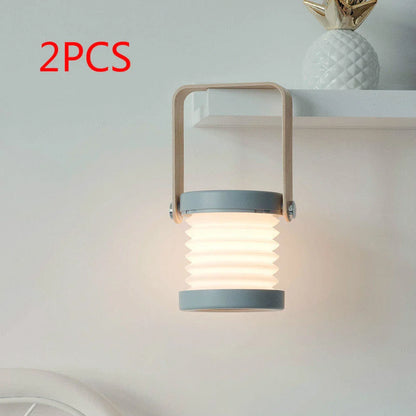 Elegant foldable LED lamp with touch-controlled dimming, rechargeable battery, and modern design for home decor