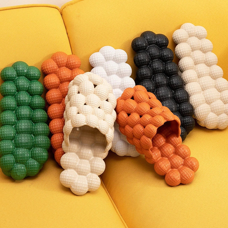 Comfortable massage bubble slides with breathable mesh upper and non-slip soles for indoor relaxation and pampering