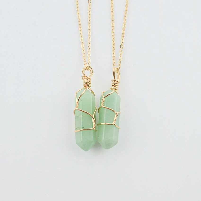 Elegant hexagonal quartz crystal necklace pendant on gold chain