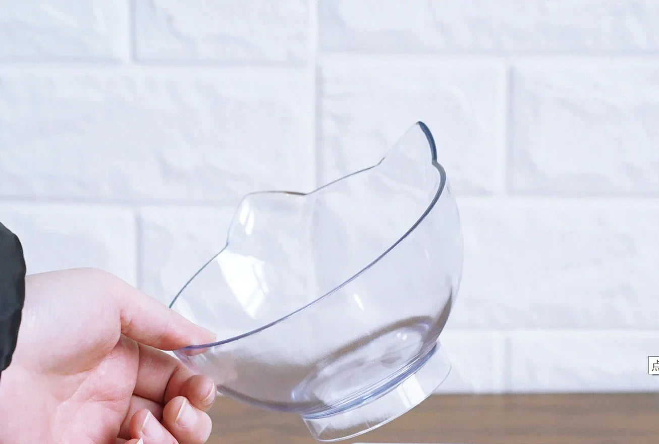 Inclined transparent cat food bowl with a gently sloped base and ergonomic design for whisker-friendly dining