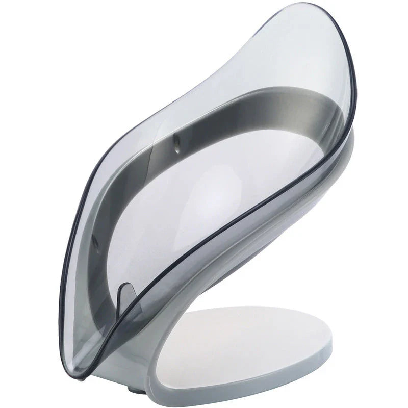 Elegant leaf-shaped soap dish with self-draining design and stable triangular shape, made of durable ABS material